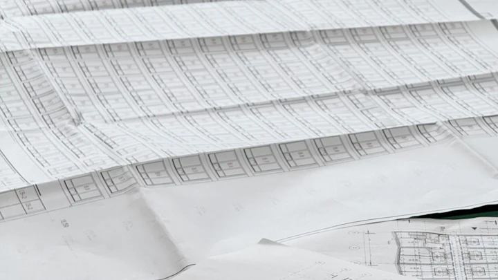 Architectural blueprints spread out on a table